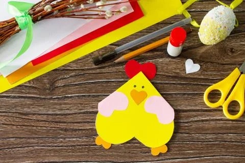 Easter postcard Easter chicken on a wooden table. Handmade. Stock Photos