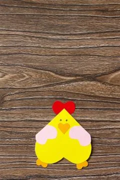 Easter postcard Easter chicken on a wooden table. Minimal style. Handmade. Stock Photos