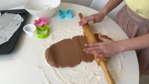 Easter preparation. dough for baking easter cookies, girl rolls out dough for Video stock 268705249