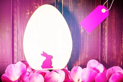 Easter rabbit and egg with rose flowers leaves close-up and sale label or tag on Stock Photos