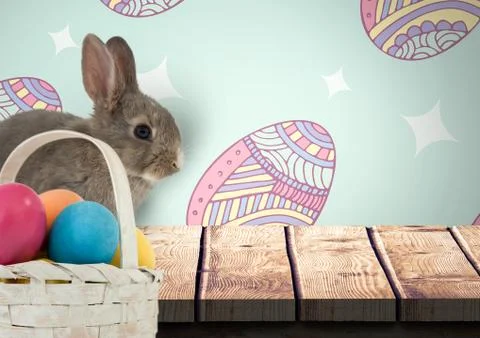 Easter rabbit with eggs basket in front of pattern Foto stock
