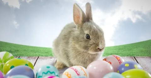 Easter rabbit with eggs in front of blue sky Stock-Fotos