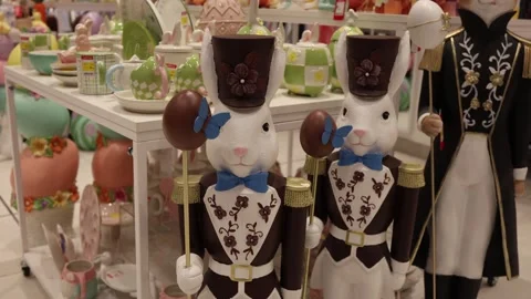 Easter rabbits with chocolate eggs festive shop display Video stock 331812170