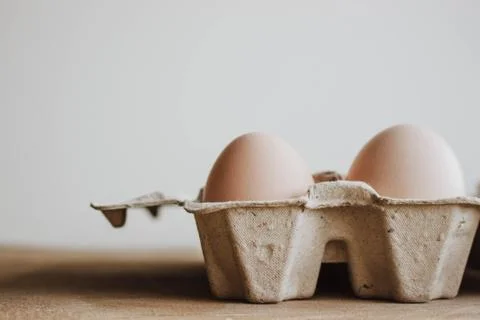 Easter raff egg. Minimal Easter concept. Craft hipster holiday package, carto Stock Photos