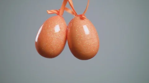 Easter red eggs with white folk pattern, hang on red ribbons with bow on white 스톡 동영상 106635180