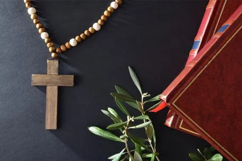Easter religious background with objects and olive branches on black Stock Photos