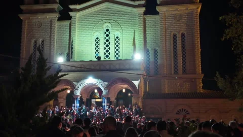 Easter Resurrection Sunday with a crowd outside an Orthodox Church in Greece. Stock Footage 307118435