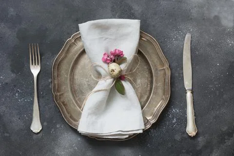 Easter romantic dinner. Elegance table setting with spring pink flowers Stock Photos