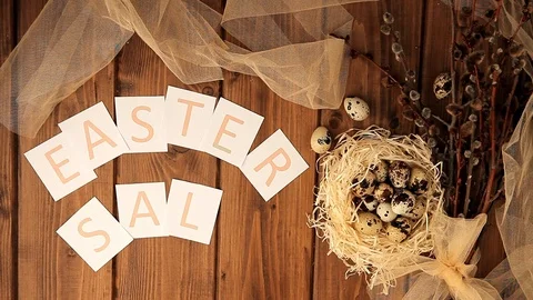 Easter sale message with Easter eggs on a wooden background. Top view (4) Stock Footage 123582830