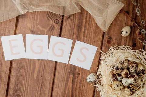 Easter sale message with Easter eggs on a wooden background. Top view Stock Photos