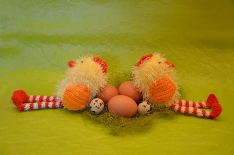 Easter scene with chick  and eggs against yellow background Stock Photos