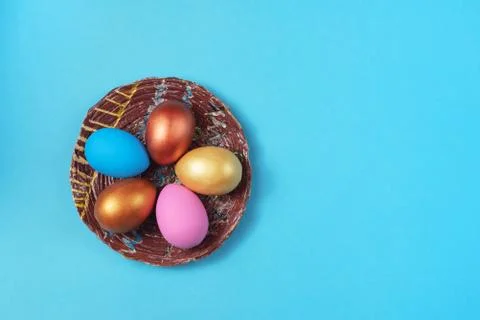Easter set of colored eggs on bright blue background Easter holiday decoratio Stock Photos