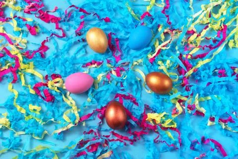 Easter set of colored eggs on bright blue background Easter holiday decoratio Stock Photos