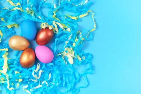 Easter set of colored eggs on bright blue background Easter holiday decoratio Stock Photos