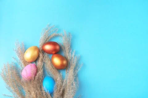 Easter set of colored eggs on bright blue background Easter holiday decoratio Stock Photos