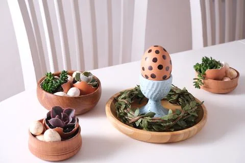 Easter set holiday table. White table with egg with polka dot  on egg stand a Stock Photos