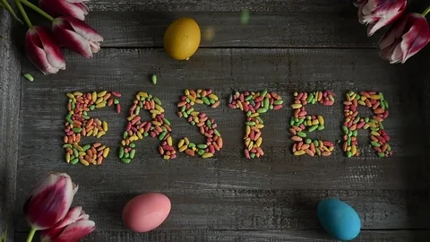 Easter sign composed of colorful candy going up in the frame, decorated wit.. Stock Footage 73379790