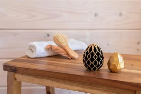 Easter spa. Rolled towels in spa salon. Golden and black eggs of geometric style Stock Illustration
