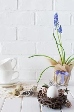 Easter spring decorative composition  with white chicken egg in a nest Stock Photos