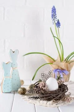 Easter spring decorative composition  with white chicken egg in a nest Stock Photos