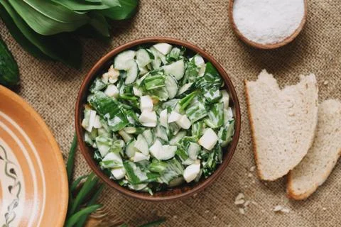 Easter spring salad with green garlic, wild leak and eggs Stock Photos