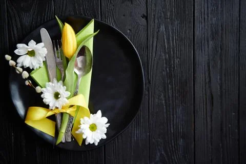 Easter spring table dishware composition with yellow tulip flower Stock Photos