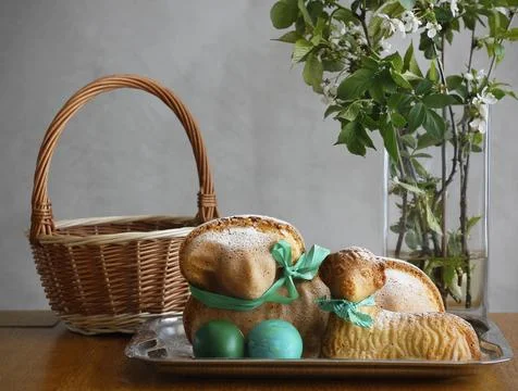 Easter still life containing two lamb cakes and two green painted eggs Stock Photos