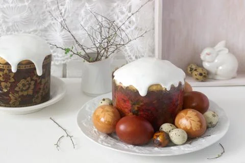 Easter still life with Easter cake kulich and painted eggs on a light backgro Stock Photos