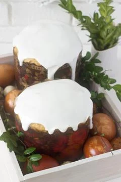 Easter still life with Easter cake kulich and painted eggs on a light backgro Stock Photos