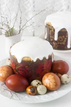 Easter still life with Easter cake kulich and painted eggs on a light backgro Stock Photos