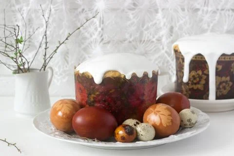Easter still life with Easter cake kulich and painted eggs on a light backgro Stock Photos