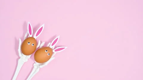 Easter stop motion animation of Easter eggs with rabbit ears in skeleton arms Stock-Footage 171363763