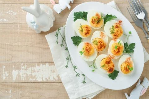 Easter stuffed eggs. Traditional Easter brunch or dinner with stuffed eggs wi Stock Photos