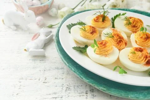 Easter stuffed eggs. Traditional Easter brunch or dinner with stuffed eggs wi Stock Photos