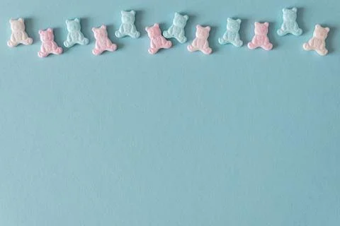 Easter Sugar Sprinkles in Shape of Teddy Bears on Blue Background Stock Photos