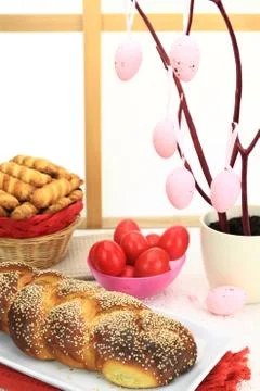 Easter sweet bread with red eggs and shortbread cookies Stock Photos
