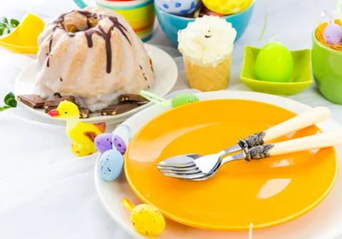 Easter table arrangement eggs sweets Stock Photos