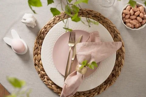 Easter table composition with bunny holder and candy almonds Stock Photos