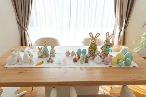 Easter Table Display with Colorful Eggs and Bunny Figurines 写真素材