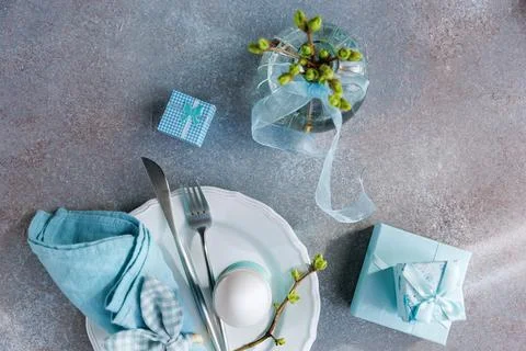 Easter Table Flat Lay with Blue Gift Boxes and Egg Стоковые фото