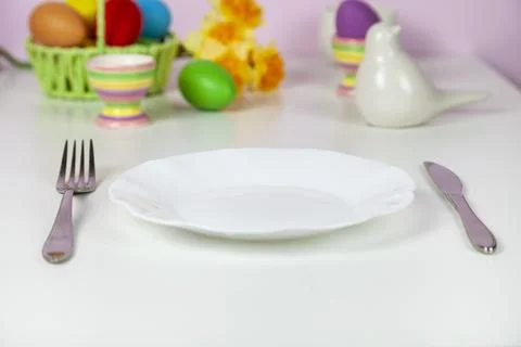 Easter table setting and dinner with festive decorations Stock Photos