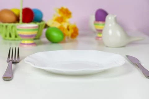 Easter table setting and dinner with festive decorations Stock Photos