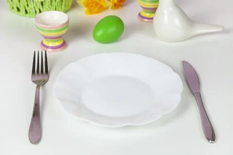 Easter table setting and dinner with festive decorations Stock Photos