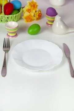 Easter table setting and dinner with festive decorations Stock Photos