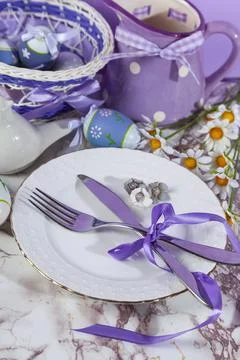 Easter table setting and dinner with yellow flowers, festive decorations, whi Stock Photos