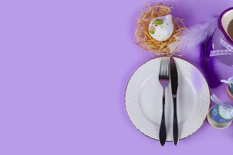 Easter table setting and dinner with yellow flowers, festive decorations, whi Stock Photos