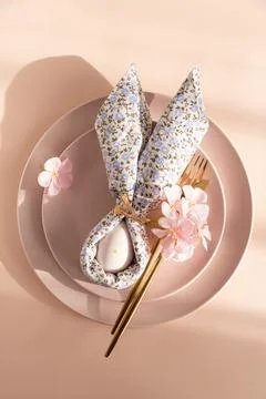 Easter Table Setting with Bunny Napkin and Decorated Egg.  Festive Spring A.. Stock Photos