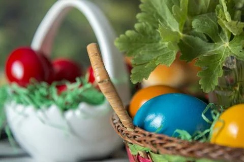Easter table setting with colored red eggs, bread, green branches decorated 스톡 사진
