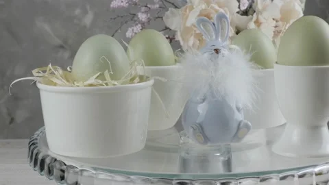 Easter table setting. Colorful eggs and rabbit. close-up. Stock Footage 169112681