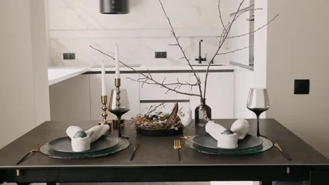 Easter table setting with crockery and colored eggs Stock Footage 185739603